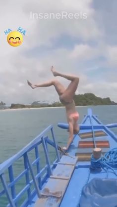 a person standing on the back of a boat