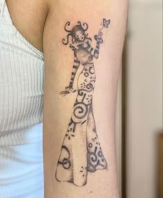 a woman with a tattoo on her arm