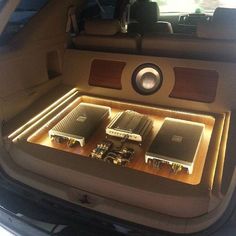 the inside of a car with speakers and other electronic equipment in it's trunk