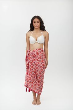 Crafted from lightweight cotton fabric, this sarong can be styled in multiple ways – wear it as a beach cover-up, a scarf, or a wrap skirt. The vibrant Aztec motif print adds a pop of color and pattern to your beach ensemble, making it a standout piece in your vacation wardrobe. Whether lounging by the pool or strolling along the shoreline, the Margot Sarong is the perfect companion for your next tropical getaway. Beachy Wrap Sarong For Beach Cover-up, Tropical Tie-side Sarong For Beach Cover-up, Beachy Cotton Sarong For Vacation, Summer Beach Sarong With Block Print, Bohemian Tie-side Sarong For Vacation, Beachy Multicolor Tie-side Sarong, Cotton Tie-side Swimwear For Beach, Bohemian Beach Sarong With Block Print, Cotton Sarong For Beach Vacation