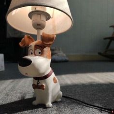 a lamp that has a dog on it with a leash around its neck and eyes