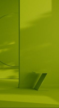 an empty room with green walls and floor