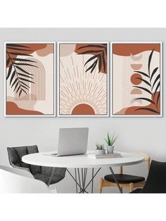 three paintings hanging on the wall above a dining room table with chairs and a laptop