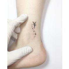 a person with a small tattoo on their foot