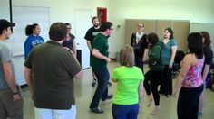 a group of people standing in a room