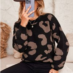 Make a statement with this oversized knit sweater featuring a bold camo print. The relaxed, slouchy silhouette exudes an effortlessly cool vibe, while the eye-catching pattern adds a modern twist to your casual looks. Crafted with a soft knit fabric, this sweater offers both warmth and style. Layer it over your favorite basics for a chic, laid-back ensemble. Product code: CAA06A3J094AG/CAA06A3J094AB/CAA06A3J094KA/CAA06A3J094CH Fall Black Jacquard Knit Sweater, Black Jacquard Knit Sweater For Fall, Trendy Patterned Crew Neck Sweater, Casual Sweater With Graphic Print For Fall, Black Oversized Sweater For Fall, Oversized Black Jacquard Knit Sweater, Trendy Acrylic Sweater For Fall, Fall Graphic Print Knit Sweater, Graphic Print Knit Tops For Fall