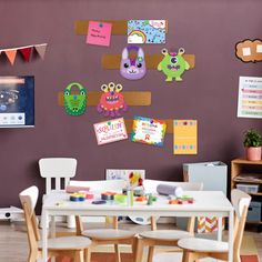 a child's playroom with wooden chairs and tables, decorated with magnets on the wall