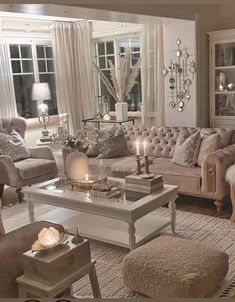 a living room filled with lots of furniture and decor on top of carpeted flooring