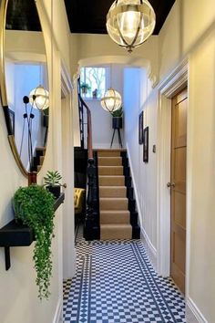 the hallway is decorated in black and white checkered tile