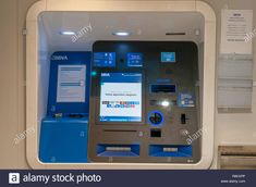 an atm machine with blue buttons and instructions on the display case - stock image ornament