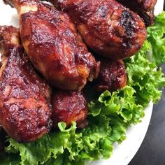 chicken wings with lettuce on a white plate