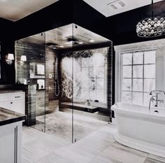 a large bathroom with a tub, sink and shower in the middle of it's walls