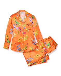 A rich tangerine silk canvas flourishes with vibrant flora, meticulously designed to capture the essence of a botanical garden in full bloom. This print is a true statement piece, smartly crafted to infuse your sleepwear with an air of elevated and playful charm. The quintessential, timeless pajama silhouette that always feels fresh: 22mm Silk, supple elastic waist, single piping detail at collar, breast pocket, and pajama pant cuff and practical pockets. As effortless and comfortable as luxury Dream Boutique, Outfit Petite, Silk Pajamas Women, Luxury Sleepwear, Silk Pajama, Silk Set, Silk Pajama Set, Striped Pyjamas, Pajama Pant