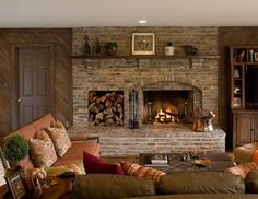 a fire place with logs in the fireplace