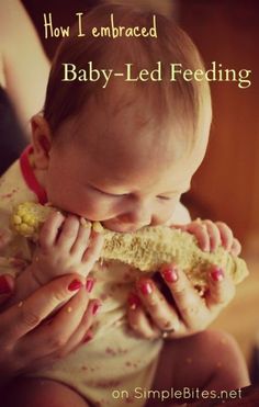 a baby is eating something while being held in her arms with the caption, how i embraced baby - led feeding