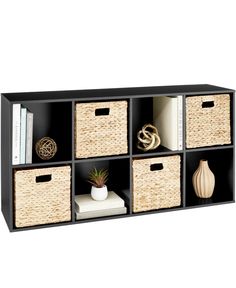 a black shelf with baskets and books on it, next to a white bookcase