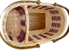 a basket that is sitting on top of a wooden stand with purple and white stripes