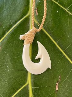 Maori Hei Matau New Zealand Fish Hook Buffalo Bone Pendant with Adjustable Cotton Cord Necklace Pendant:  Approx. 2" long, 1" wide Cord Necklace:  Approx. 28" long (Adjustable) Maori Hook, Hook Tattoo, Hook Tattoos, Cotton Cord Necklace, Bone Necklace, Bone Pendant, Bone Horn, Necklace Choker, Cord Necklace