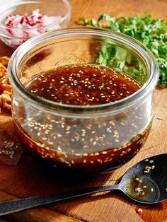 sesame ginger dressing in a glass jar on a cutting board