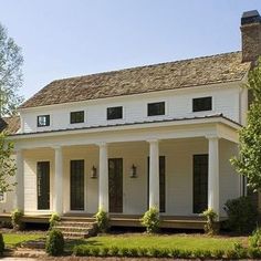 a white house with columns on the front