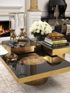 a coffee table with books and candles on it