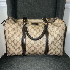 This Gucci Boston Tote Is Crafted From Monogram Canvas And Metallic Leather. It Features Dual Rolled Leather Top Handles, Zip Closure With Leather Tab, Dark Brown Linen Interior Lining With One Open Pocket, And Metallic Tone Hardware. The Bag Is In Used Condition The Monogram Canvas, Interior Fabric And Hardware. The Leather Trims And Handles Have Some Wear And Tears As Shown By The Pictures. Please Reference Pictures. Authenticity Also Shown Measurements Length: 13 In Height:8.5in (Without Handles) Depth: 7 In Handles Height: 4.5in Linen Interior, Reference Pictures, Interior Fabric, Boston Bag, Metallic Leather, Leather Top, Monogram Canvas, Leather Trims, Dark Brown