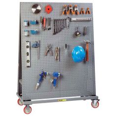 a metal pegboard with tools on it