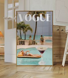 a magazine cover with a woman laying on a lounge chair next to a pool