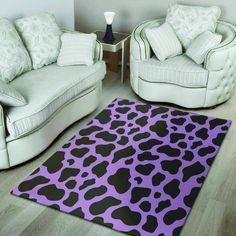 a black and white cow print rug in a living room