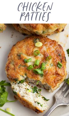 chicken patties on a white plate with a fork and parsley garnish