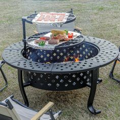 an outdoor table and chairs with food on it