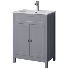 a bathroom vanity with a white sink and grey cabinet doors on the front, side view