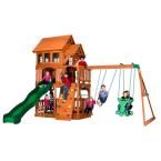 a wooden swing set with children playing on it