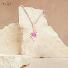 Description In a sound pressure setting, a gleaming round Pink Sapphire is linked to a twisted design. The beautiful style of this Pink Sapphire solitaire pendant attracts all attention to its bright pinkish color. It is made of 14k solid gold. The gold chain shown in pictures is just for reference and display purpose, in order pendant comes with a COMPLIMENTARY 925 SILVER CHAIN. Product Details SKU CJ-P-1408-PS Metal 14K Solid Gold Product dimension 18.65mm x 7.60mm Birthstone September STONE D Birthstone Jewelry Mothers, Black Diamond Pendant, Pink Sapphire Pendant, Bridal Pendant, Birthday Pendant, Pink Sapphire Earrings, Blue Sapphire Pendant, Unique Pendant Necklace, September Birthstone Jewelry