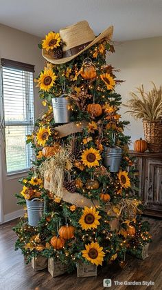 a christmas tree decorated with sunflowers and pine cones