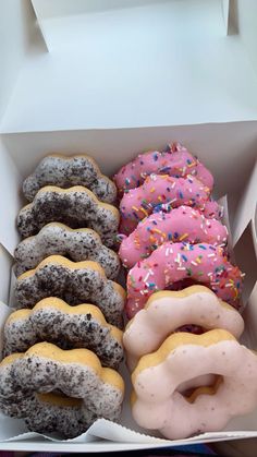 a box filled with lots of different flavored donuts