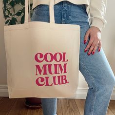 The Cool Mum Club slogan tote bag, Mothers day gift. A fashionable gift for a Cool Mum. This is a practical tote bag that can be used to carry both their  and their baby's stuff. A simple Christmas, birthda, a Mother's Day gift for a trendy cool Mum, friend or your sister, or even a treat for yourself! Made from 100% Cotton Canvas Individually Hand Printed Design Dimensions: Height 42 cm x Width 38cm Gusset depth: 10cm To keep your tote in tip top shape hand wash. Do not tumble dry or iron the print. FOLLOW OUR SOCIAL AND TAG US #SYDANDCO FOR YOUR CHANCE TO FEATURE Canvas Shopper Bag, Mum Life, Cool Phrases, Mom Tote Bag, Bag Quotes, Christmas Tote Bags, Mum Birthday Gift, Painting Inspo, Day Bag