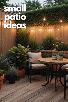 an outdoor patio with potted plants and string lights on the wall, surrounded by wooden decking