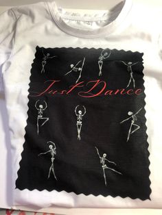 An interesting fall themed t shirt   The shirt has skeletons in various dance positions and just dance printed in red.  On the back is a single skeleton in a dance position.  The background of the print is black but can be done in any color of your choice.  A name can be added to either the front or back at no additional charge  This is a polyester shirt that can be washed and dried Dance T Shirt, Polyester Shirt, Kids Graphic Tees, Just Dance, Autumn Theme, Skeleton, Kids Tshirts, Gender Neutral, Graphic Tees