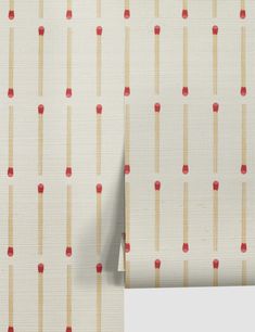 a white wall with red and beige stripes on it