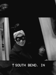 a person wearing a mask and standing in front of a mirror with the caption south bend, in