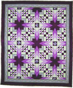 a purple and black quilt with stars on it