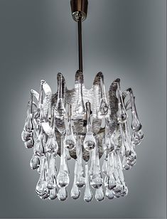 a chandelier with glass drops hanging from it