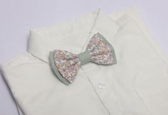 This Floral dusty sage green tie/bow tie  is a Wedding Favorite ~it  is perfect for weddings or special occasions. Fabric: linen / cotton floral  Fabric Care: Dry-clean Only The width of suspenders: 2.5cm/1 inch Return Policy: If you are unhappy with your item, be it damage, defect or otherwise, we will happily accept a return/exchange.  Returns must be unworn, unwashed, undamaged, and unaltered. Items not in this condition can not be returned. All orders  will require the customer to ship at th Dapper Spring Bow Tie For Weddings, Dapper Bow Tie For Spring Weddings, Dapper Spring Wedding Bow Tie, Boys Ring, Toddler Suspenders, Sage Green Tie, Ring Bearer Boy, Baby Suspenders, Tie And Suspenders