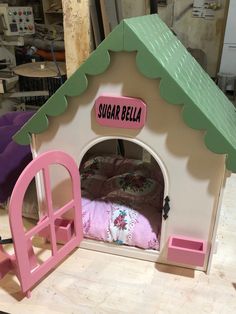 there is a doll house made to look like a bed