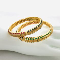 2.6 size Golden multicolor stone Bangles/Sabyasachi Bangles/American Diamond Ruby Bangles/CZ Indian wedding jewelry/Golden Indian Bangles Features Traditional Semi-Precious Colored stone bangles Set Handcrafted To Perfection Light Weight Perfect For Indian Weddings And Celebrations A Beautiful & Memorable Gift for Weddings and Special Occasions Available in 2.6 size The base metal color is Gold tone brass studded with colorful semi-precious stones on it. Facebook: www.facebook.com/Shoparyafa Sabyasachi Bangles, Stone Bangles, Ruby Bangles, Indian Bangles, Bangles Set, Bracelets Design, Bangles Indian, Stone Bangle, Ruby Emerald