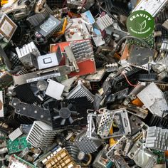 a pile of assorted electronic components including cpus and other electronics, with the words green logo above them