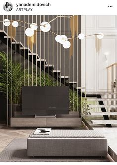 the living room is decorated in black and white with gold accents on the railings