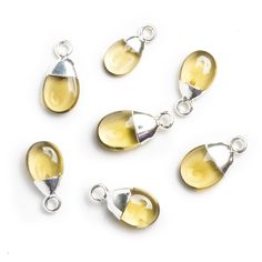 Silver Leafed Lemon Quartz Pear Pendant 1 Bead (M) - The Bead Traders Modern Pear-shaped Silver Jewelry, Modern Yellow Teardrop Jewelry, Sterling Silver Yellow Charms Jewelry, Yellow Natural Stones Sterling Silver Necklace, Yellow Faceted Teardrop Jewelry, Lemon Quartz Necklace, Yellow Color Palette, Pear Pendant, Black Gold Chain