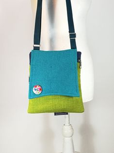 "This designed Canvas small bag is a great bag for daily use. It consists of a variety of fabric which makes it unique and beautiful. The bag is closed by a zipper and  Another  back pocket closed with a zipper, great safe storage of objects / Mobile Phone . The straps are soft and can be adjusted. on the bag a designed button that adds nice chiq to the bag  A perfect small zipper purse cross body bag for people who are minimalist.  --------------------------------------------------------------- Green Crossbody Phone Bag For Travel, Eco-friendly Green Pouch Shoulder Bag, Green Square Shoulder Bag With Cell Phone Pocket, Green Travel Pouch Phone Bag, Green Pouch Shoulder Bag With Cell Phone Pocket, Green Pouch Phone Bag For Travel, Versatile Green Phone Bag For Travel, Green Phone Bag With Removable Pouch For Travel, Green Crossbody Phone Bag With Removable Pouch